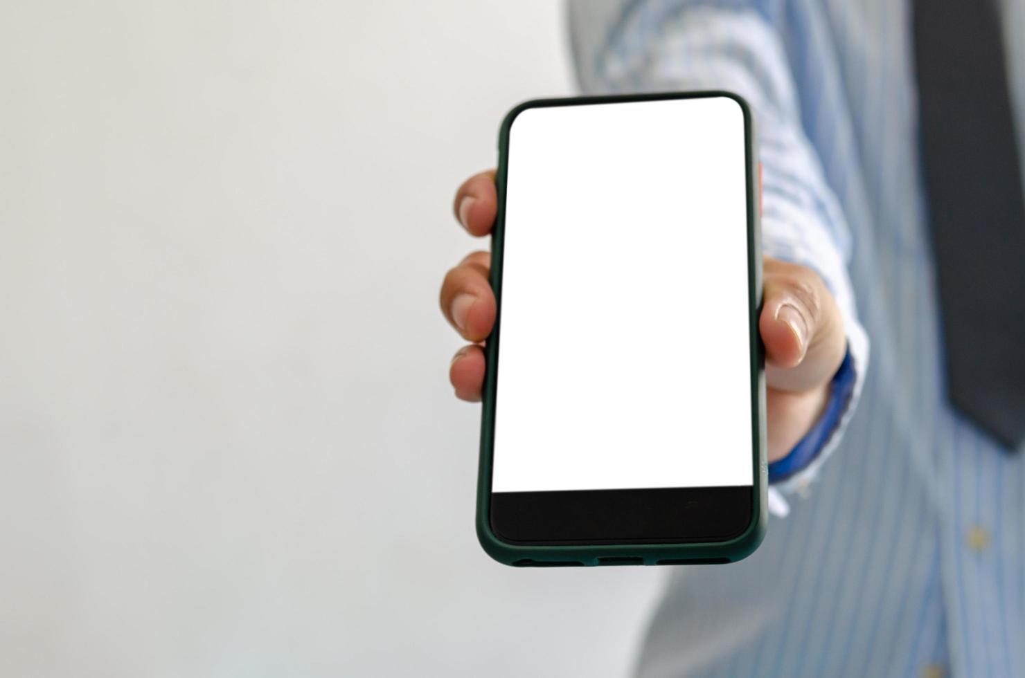 Person holding blank phone mock-up photo