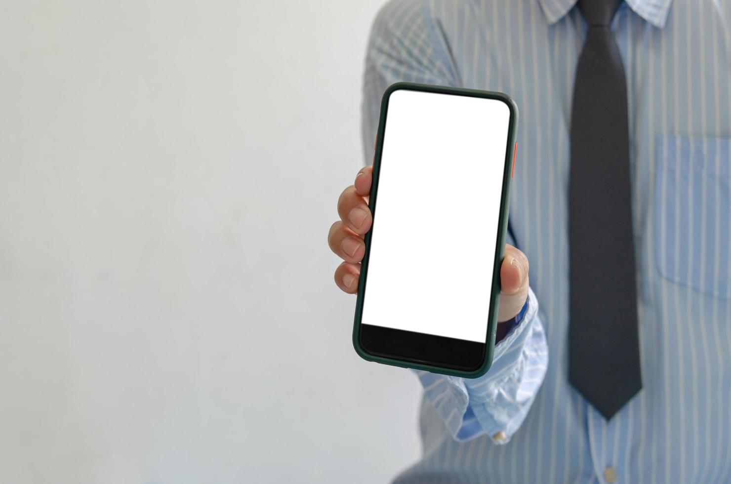 Professional holding blank phone mock-up photo