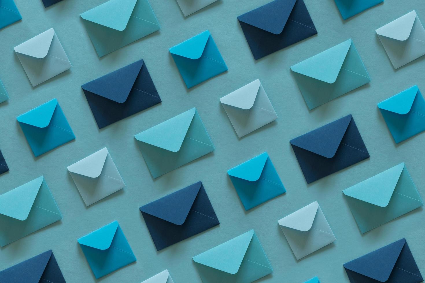 Line of envelopes in blue tones. photo