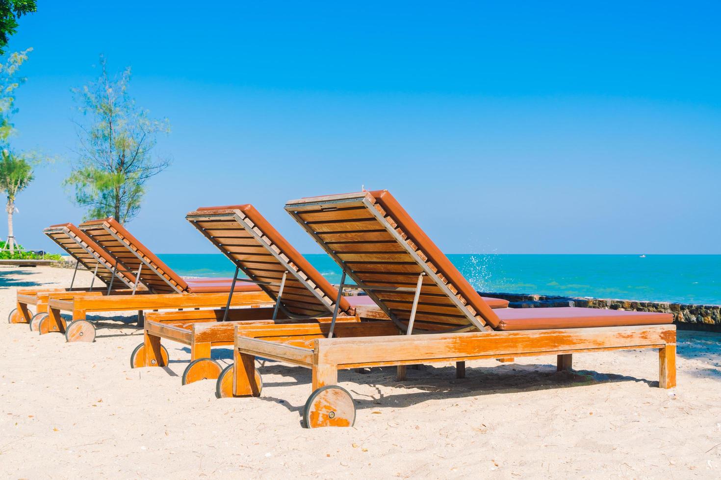 Umbrella pool and chair on the beach photo