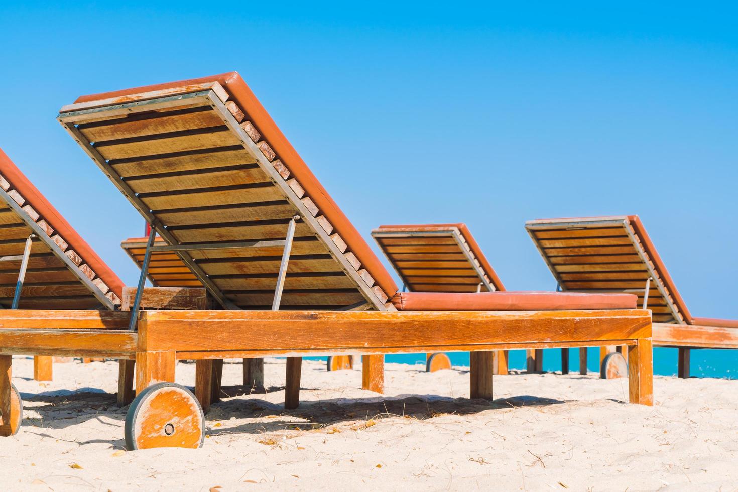 Sunbathing beds on the beach photo