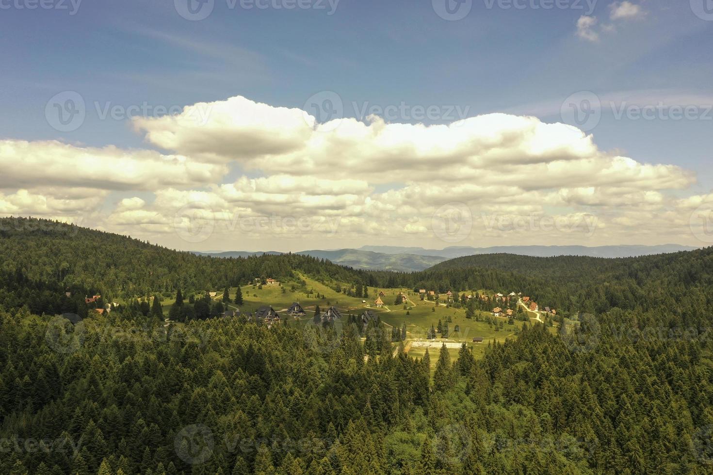 Aerial view at mountain forest on a summer day photo