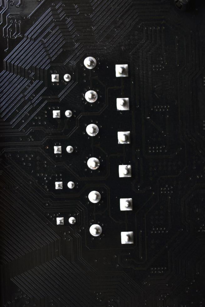 Black computer chip close-up with elements and tracks photo