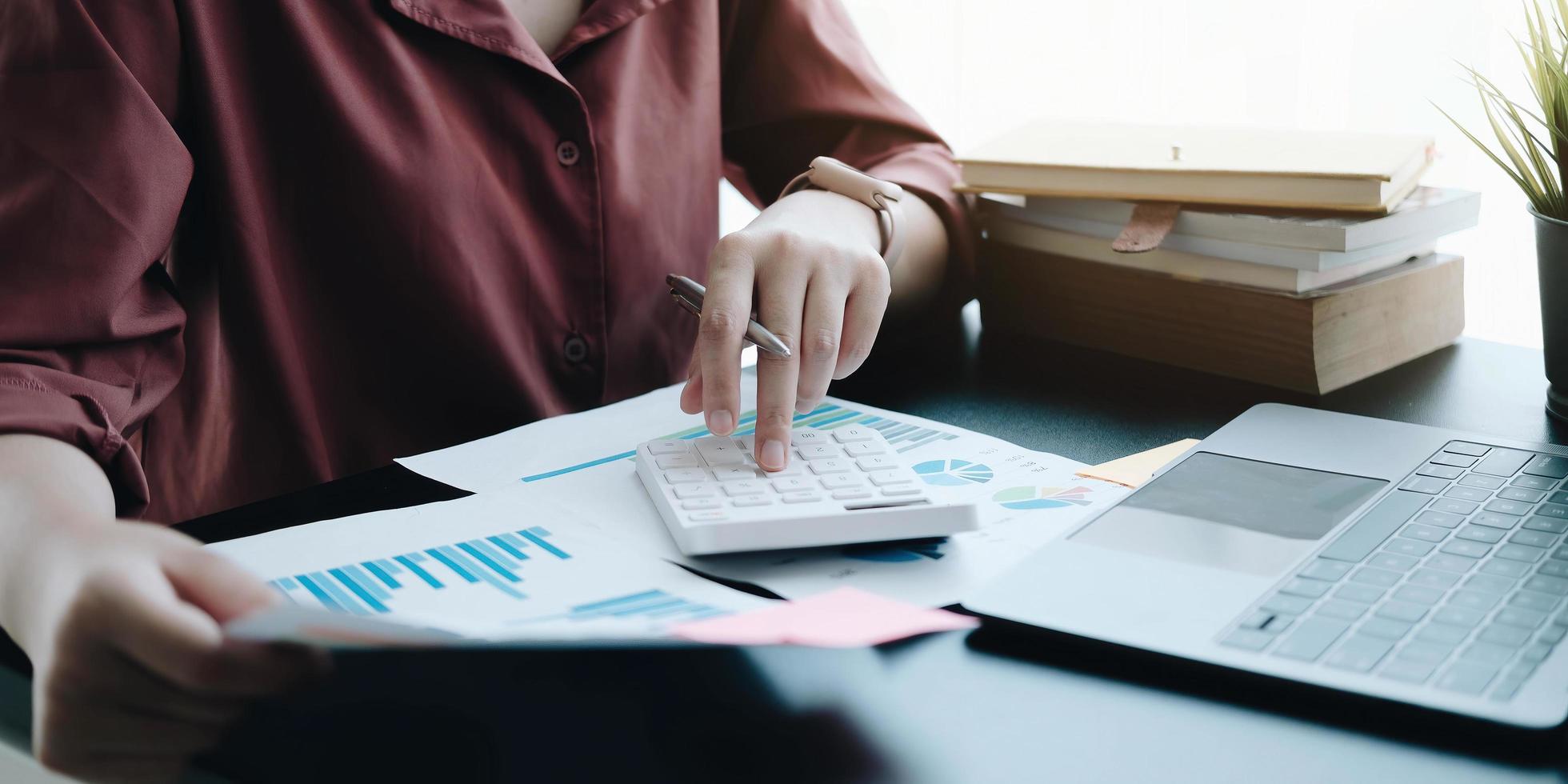 Professional making calculations and looking at graphs photo