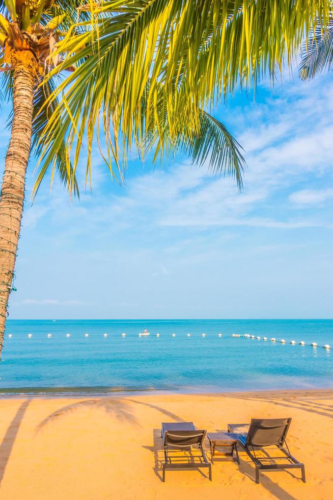 Beautiful beach and sea with palm tree photo