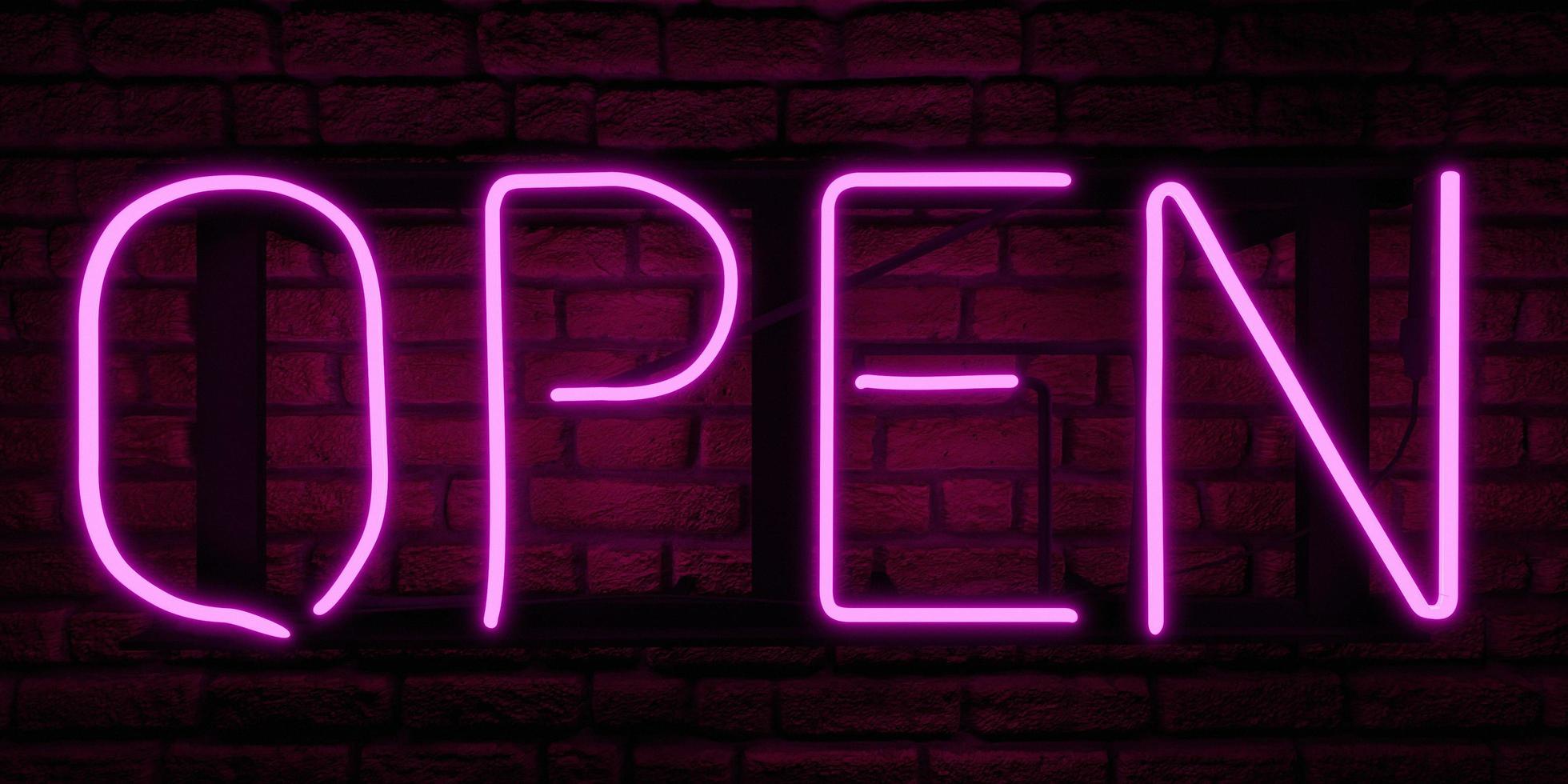 Neon pink sign with the word OPEN on brick wall, 3d rendering photo