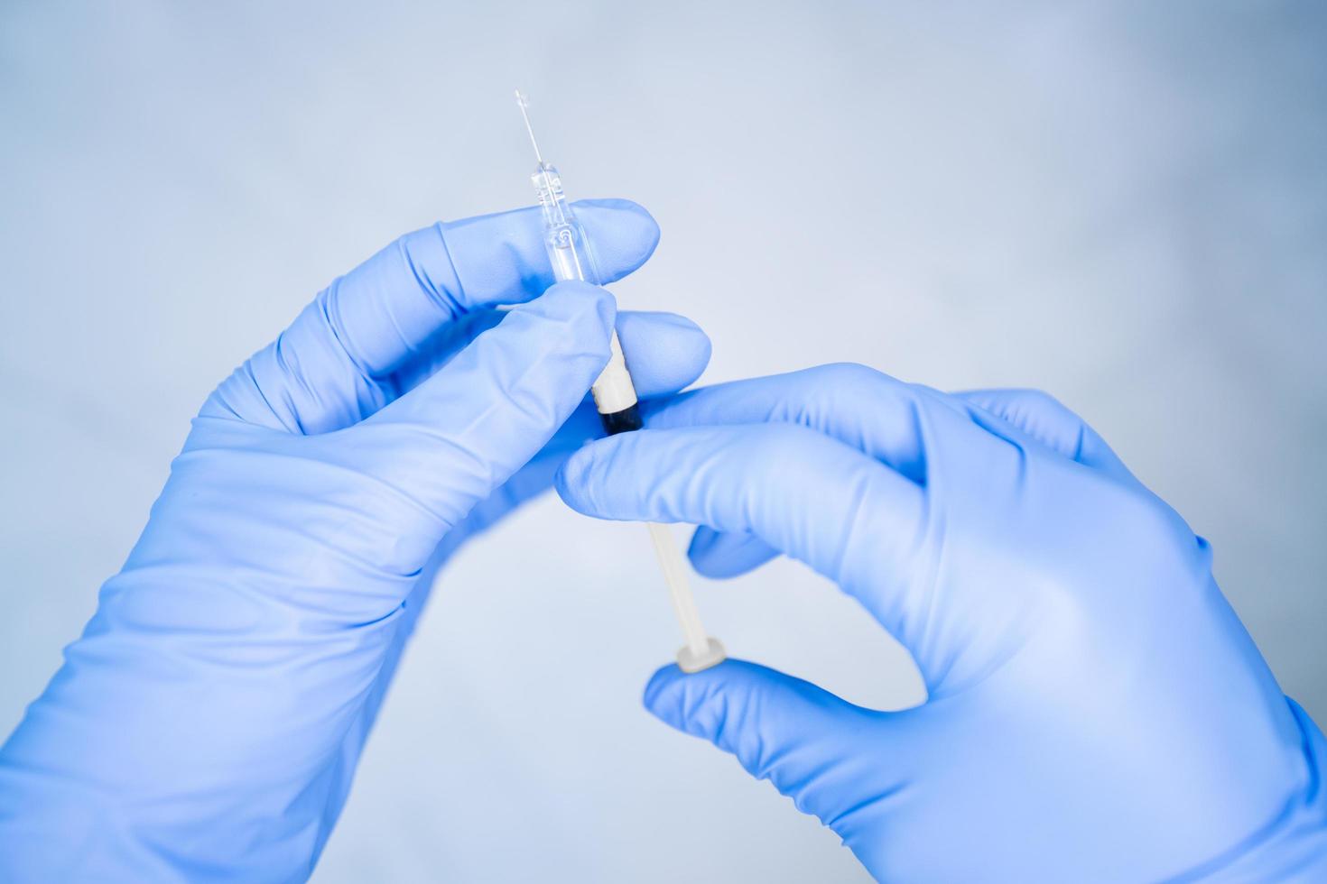 Close-up of nurse hands preparing vaccine photo