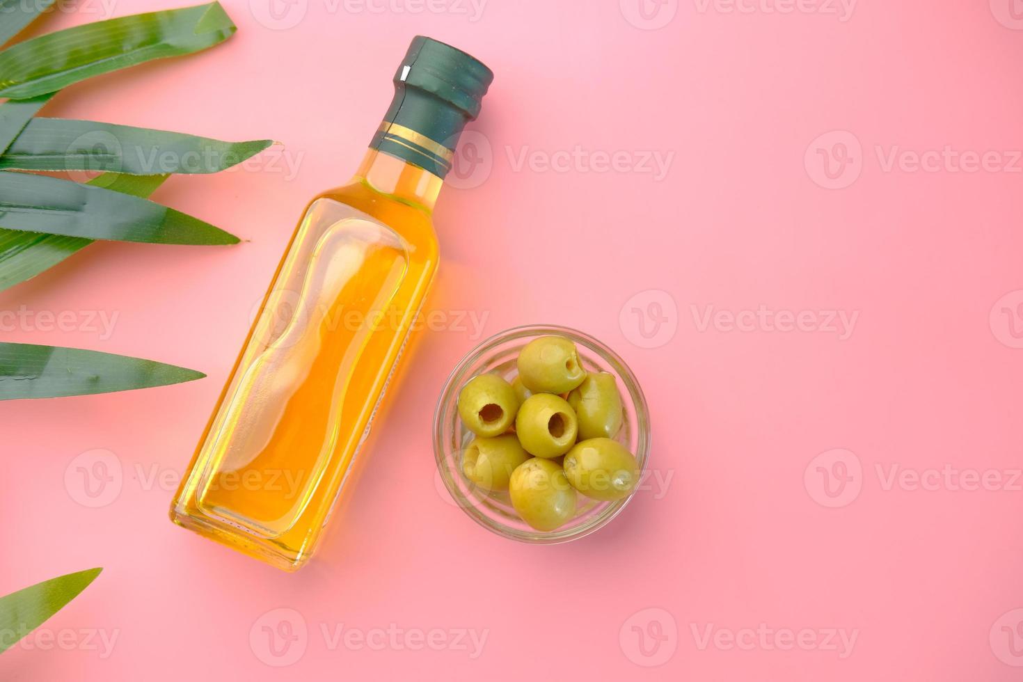 Flat lay of olives and olive oil photo