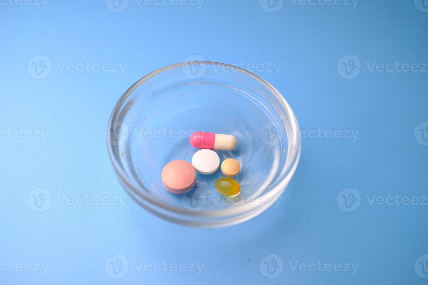 Pills in a glass bowl photo