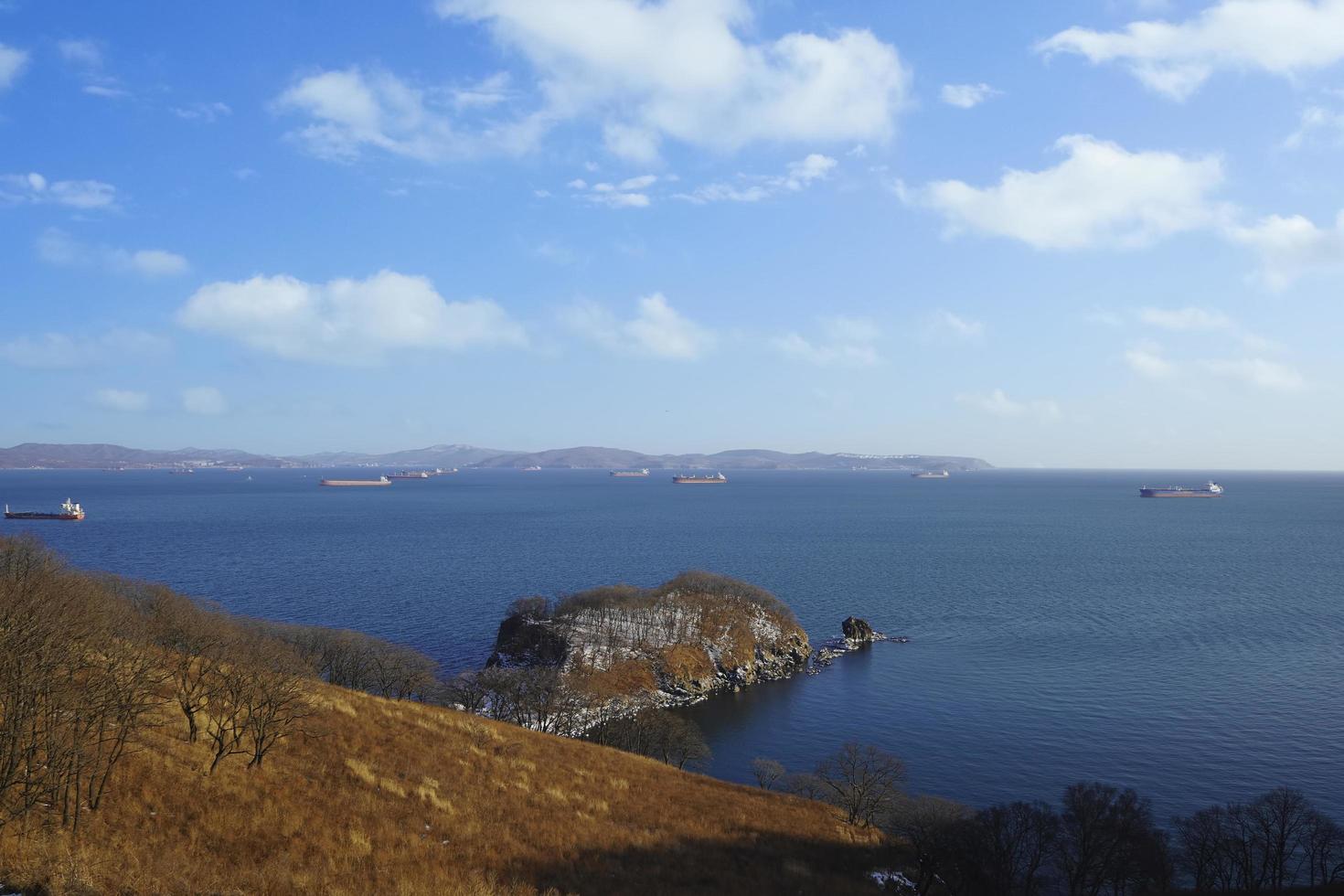 Seascape of Nakhodka Bay with cloudy blue sky in Russia photo