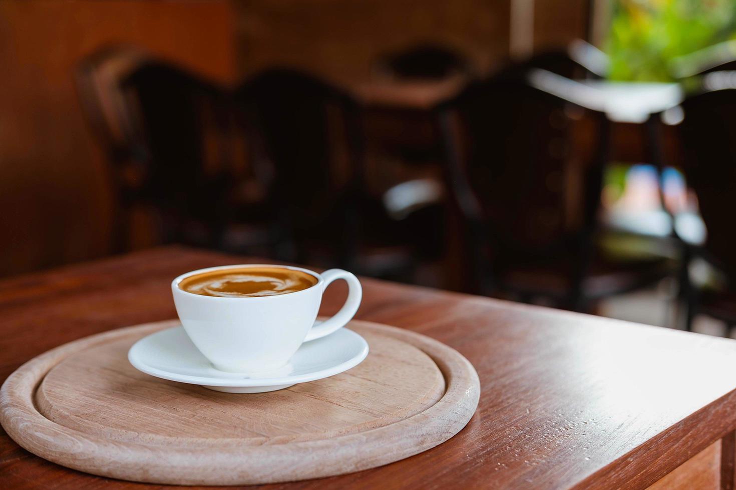 Latte on a wooden board photo