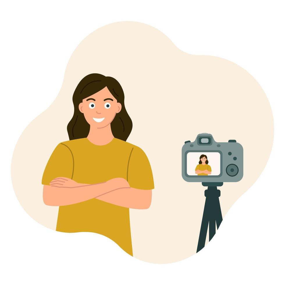 The girl crossed her arms and smiled at the camera. Photos and videos from a tripod, posing. vector