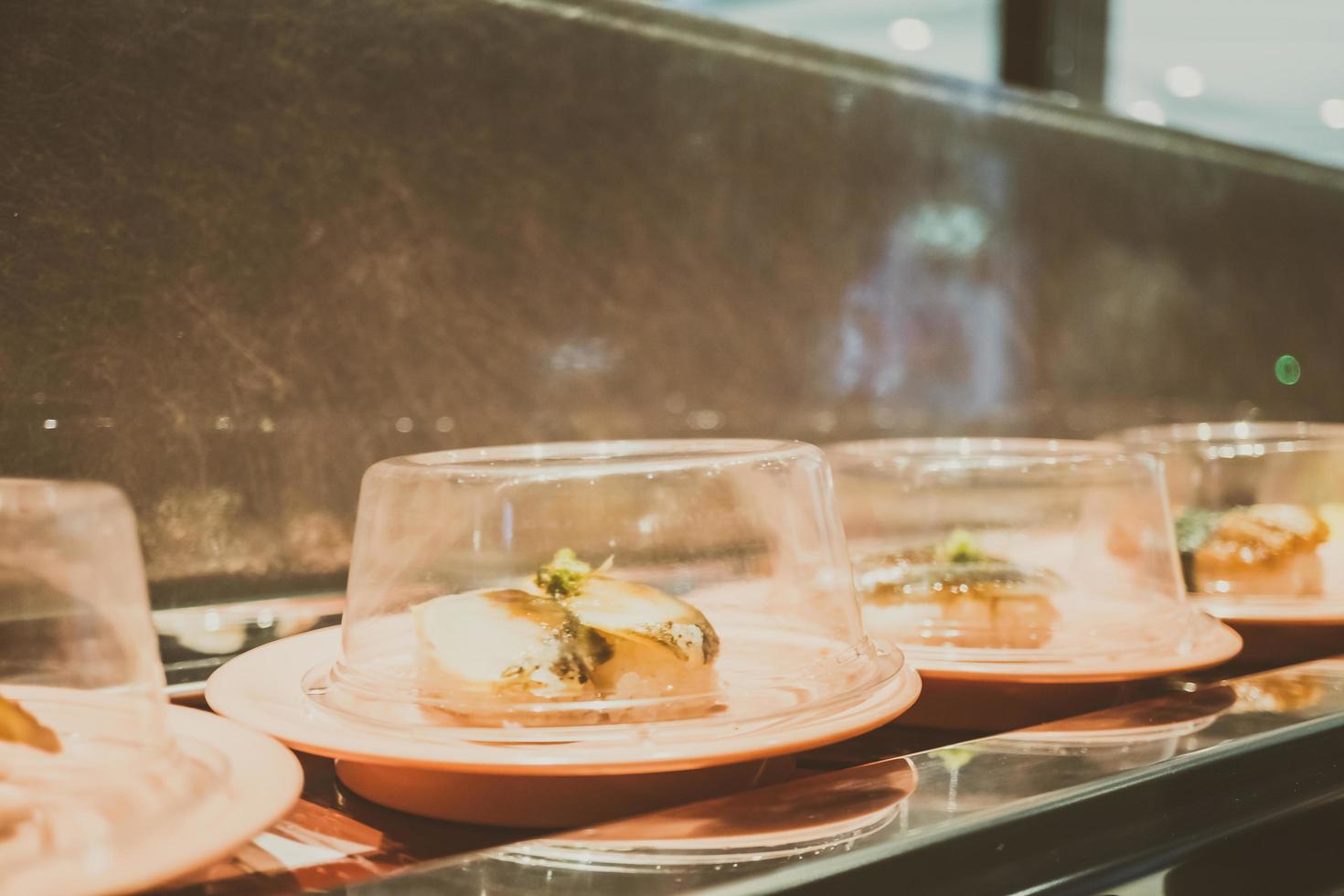 Sushi tray on conveyor belt photo