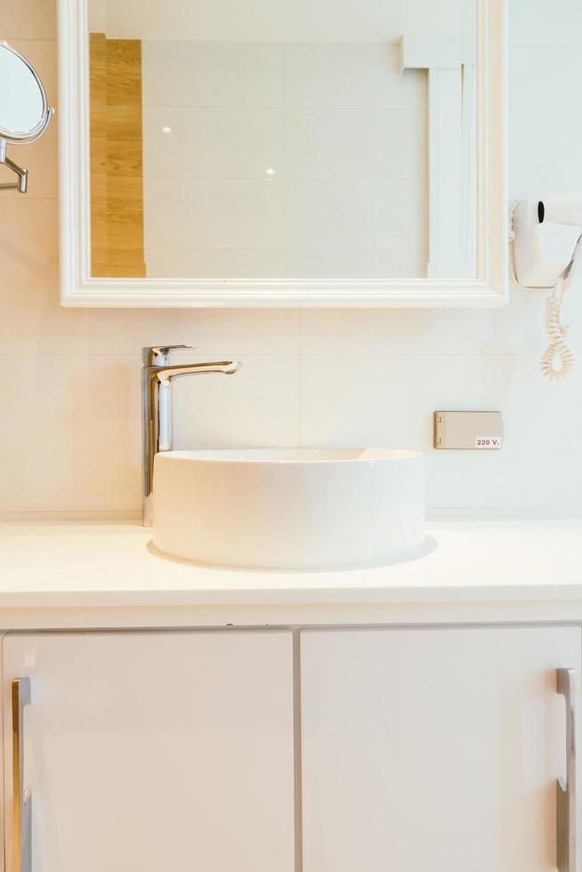 Faucet and sink in bathroom photo