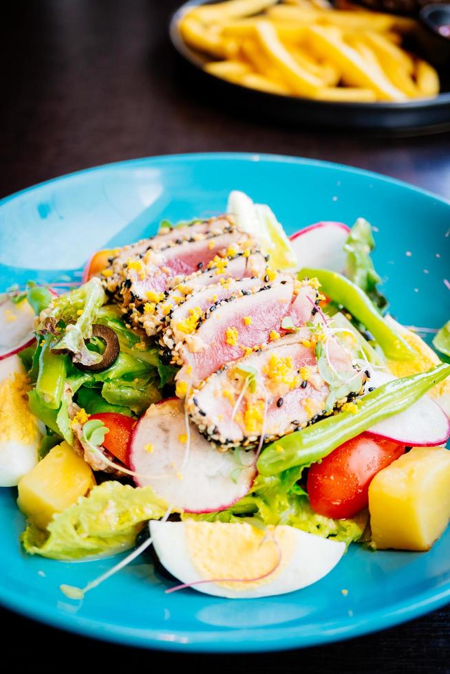 Raw and fresh tuna meat with sesame and salad photo