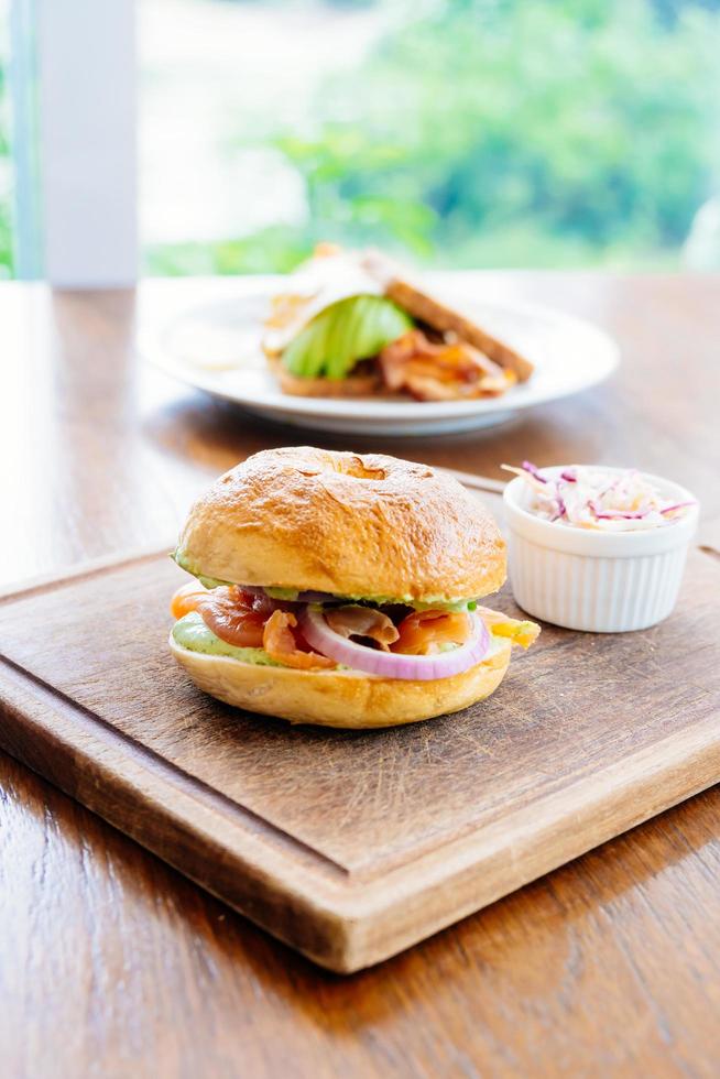 Bagel bread with smoked salmon meat and vegetable photo