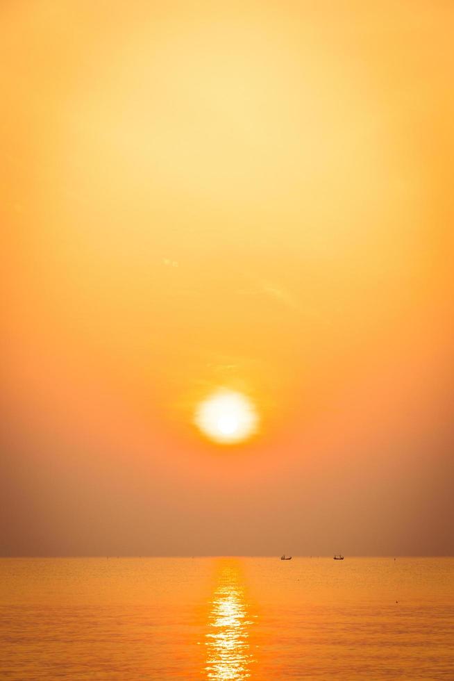 Beautiful sunrise on the beach and sea photo