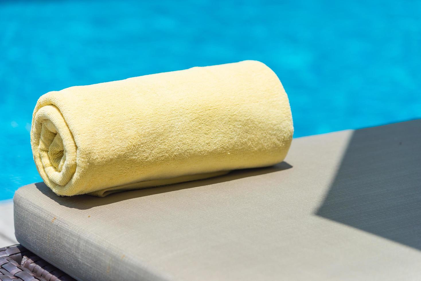 Towels on the bed at the pool photo