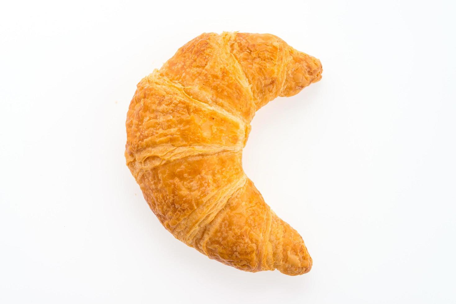 croissant aislado sobre fondo blanco foto