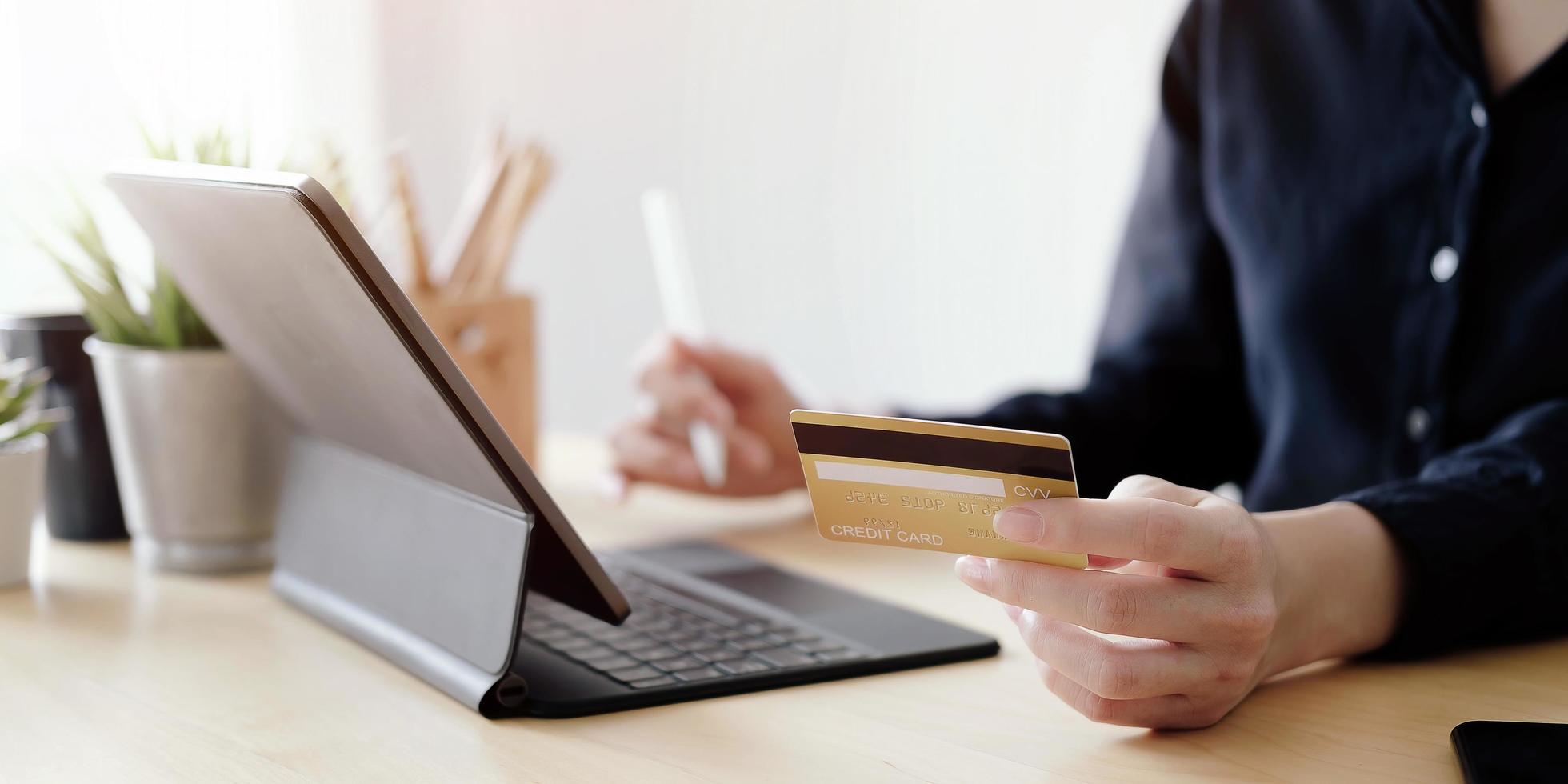 Close-up of a person paying online photo