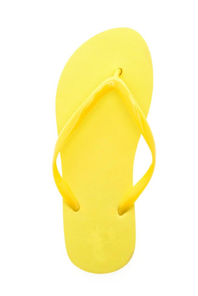 Yellow flip flops isolated on white background photo