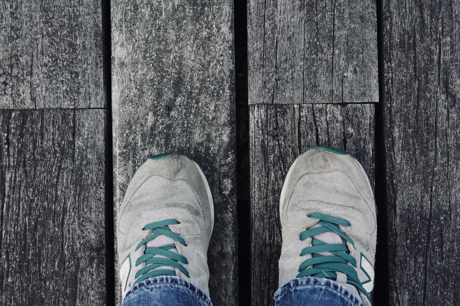 Man with sneakers walking on the street photo