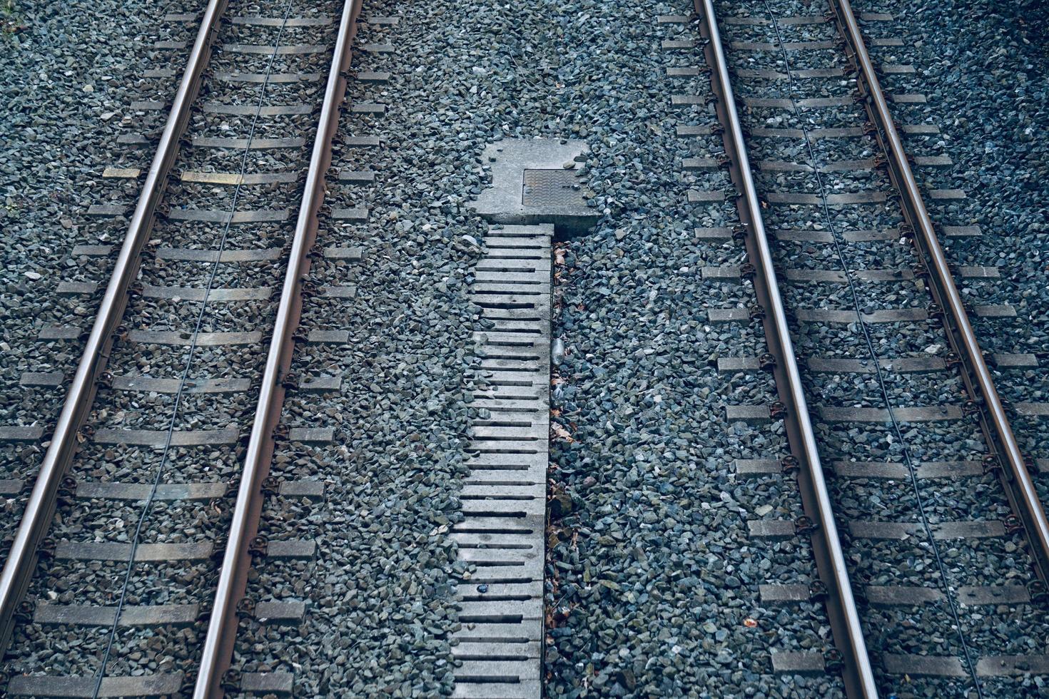 Railroad track in the station, train mode of transportation photo