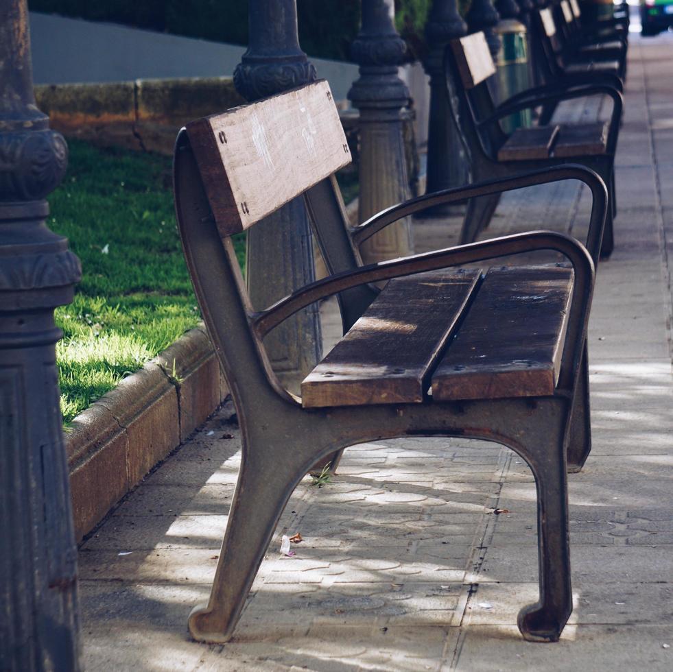 Wooden bench on the street photo