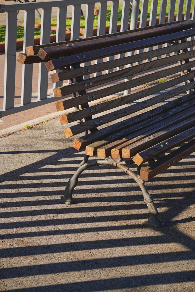 Wooden bench on the street photo