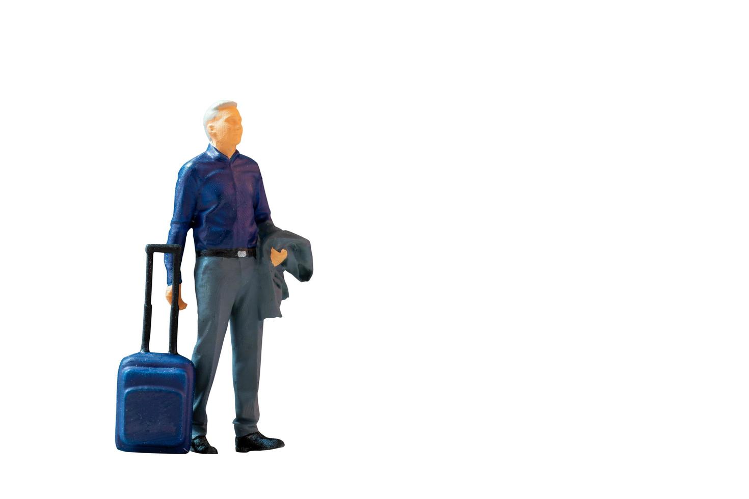 Miniature people Businessman with luggage on white background photo