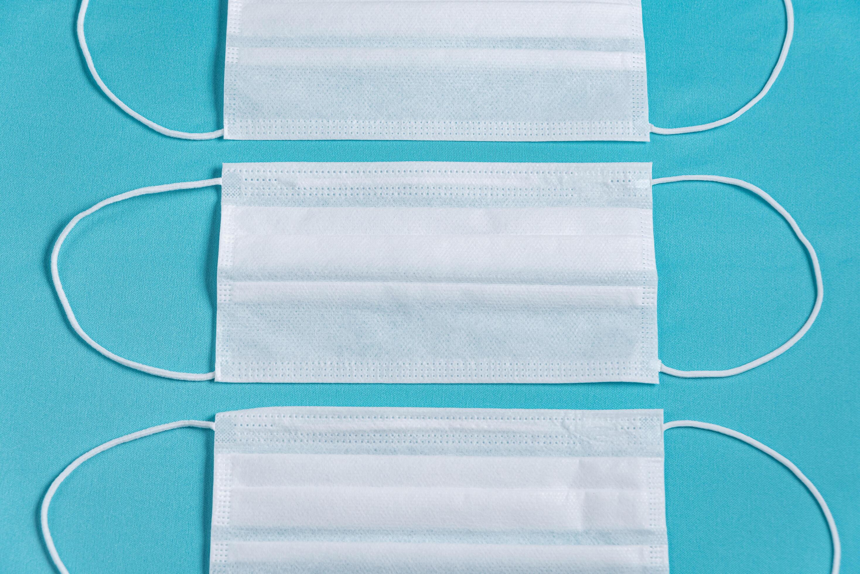 Surgical mask over minimalist blue background 2287564 Stock Photo at