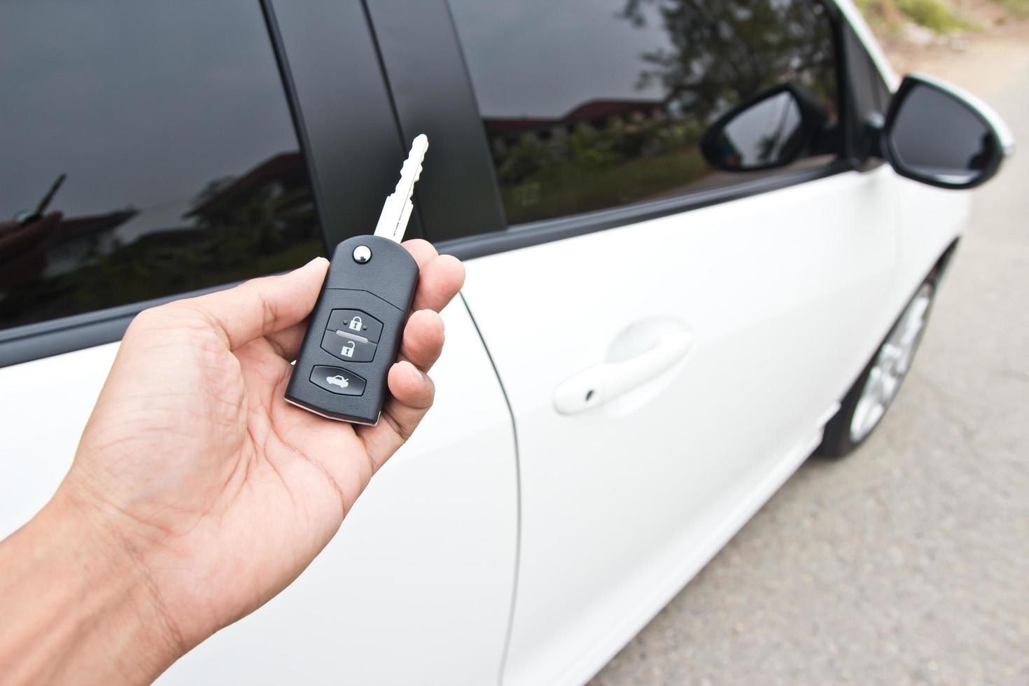 Car keys on a white car photo