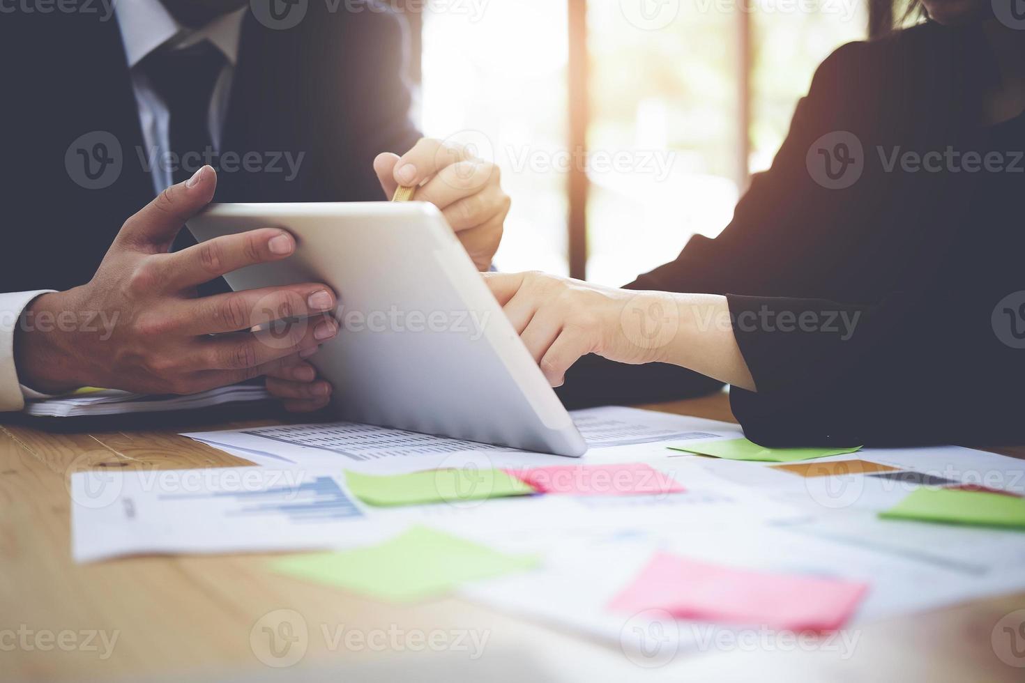 Fund managers team consulting and discussing analysis, investment into the stock market by paperwork. Vintage concept. photo