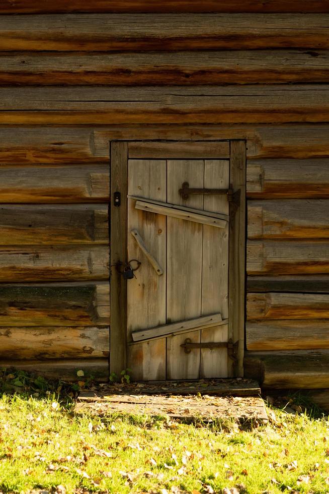 Wooden door in a wooden house photo