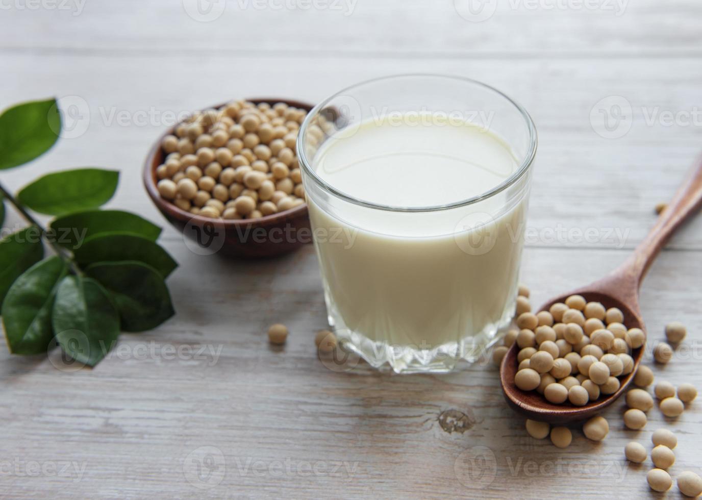 Soy milk and soy on the table photo