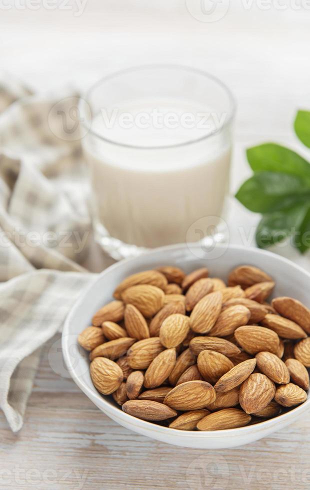 Almond milk and almonds photo