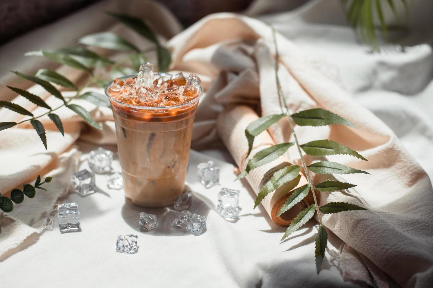 Close-up glass of iced coffee with milk on the table photo