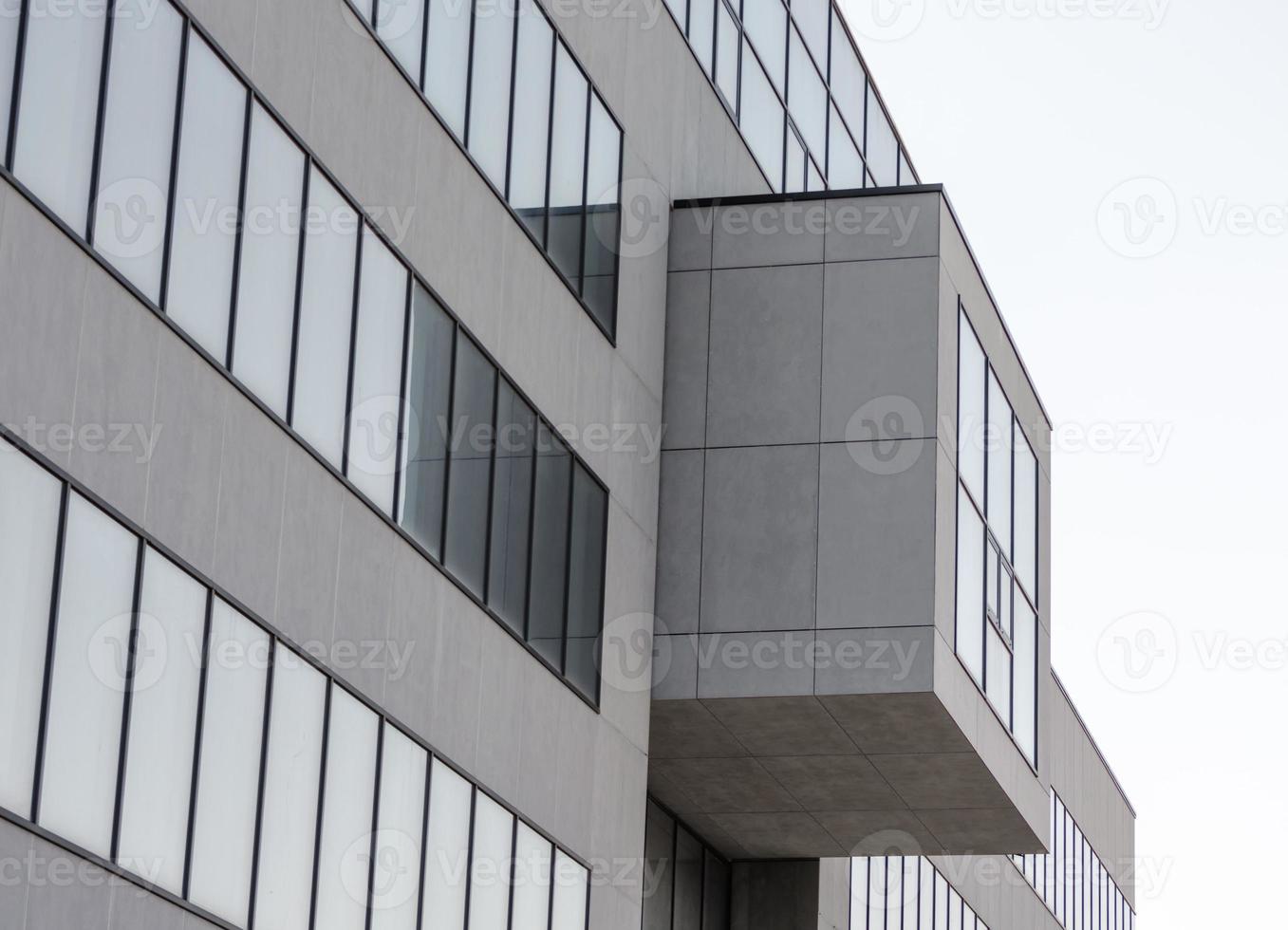 Large gray concrete structure with empty windows photo
