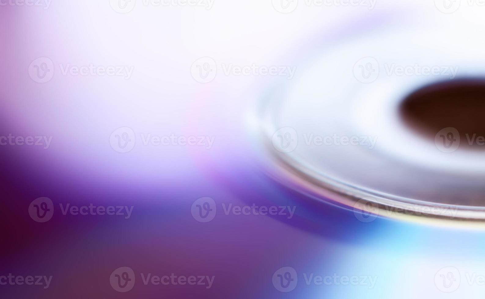 Compact disc surface, macro abstract multi-colored pattern background photo