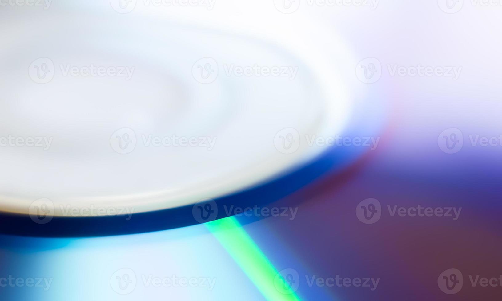 Compact disc surface, macro abstract multi-colored pattern background photo