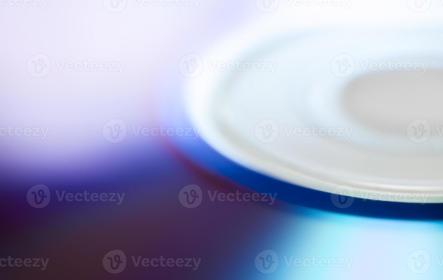 Compact disc surface, macro abstract multi-colored pattern background photo
