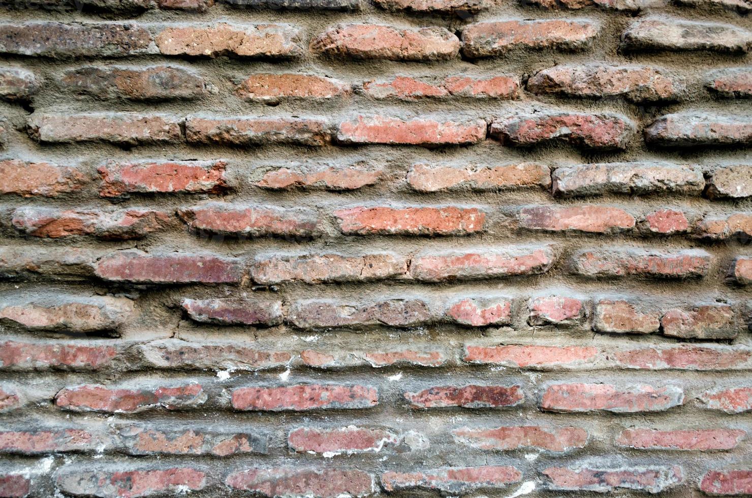 Pattern texture of old vintage orange brick wall, detailed background close up photo