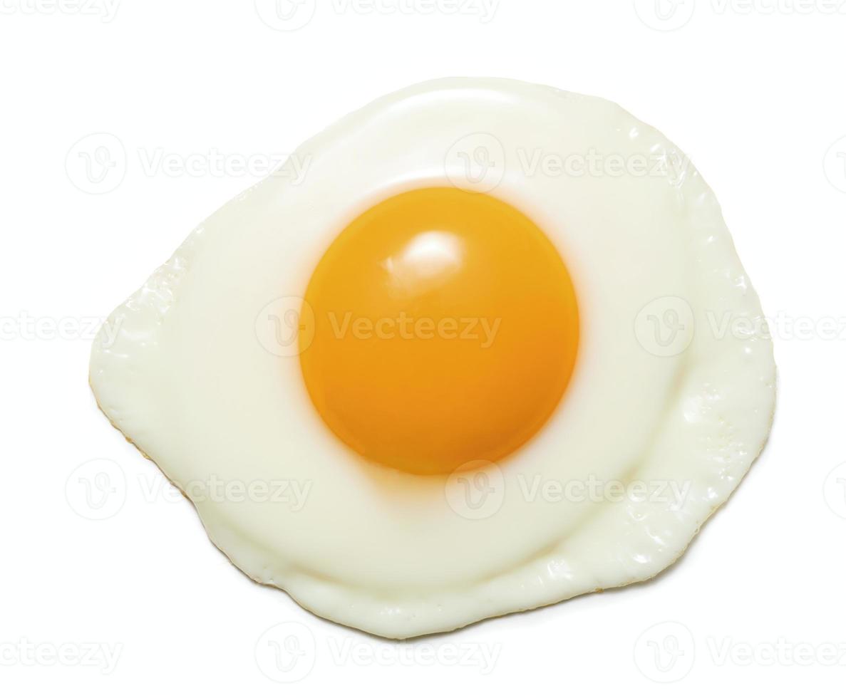 Top view of fried egg isolated on white background photo