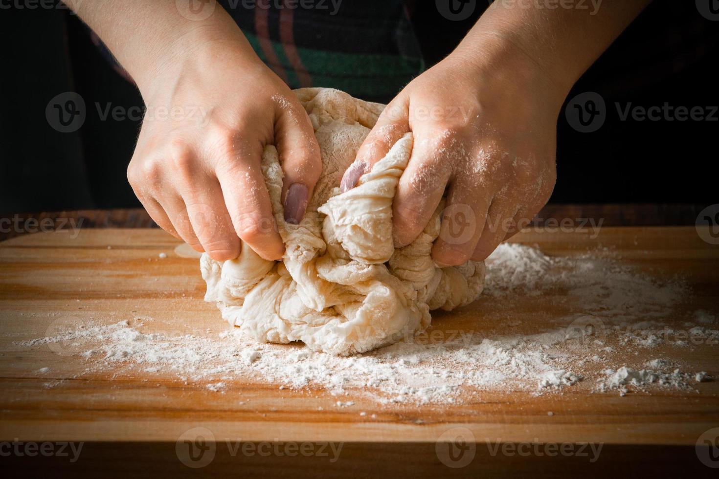 The chef prepares pizza dough photo