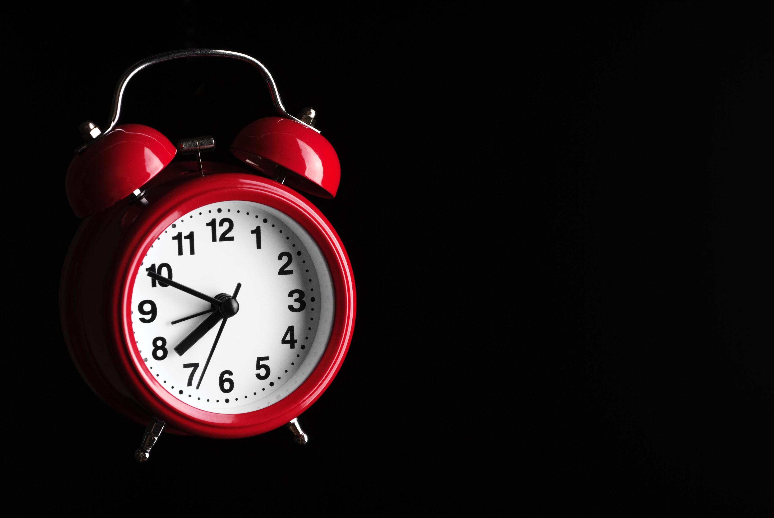 Red alarm clock on black background 2290242 Stock Photo at Vecteezy