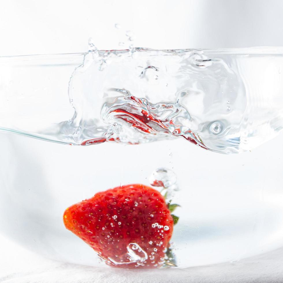 Strawberry in water photo