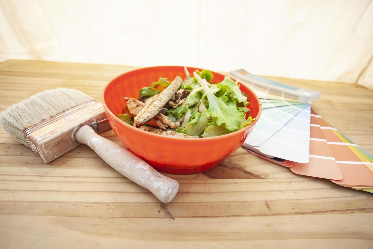 Grilled mackerel in a bowl with a paint brush and samples photo