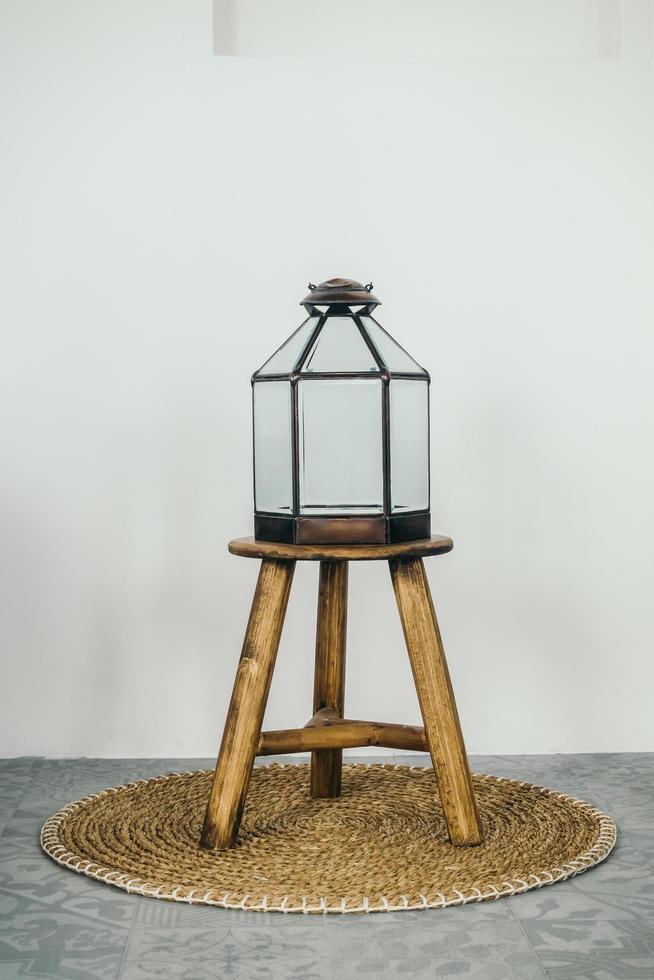 Lamp on a wooden stool photo