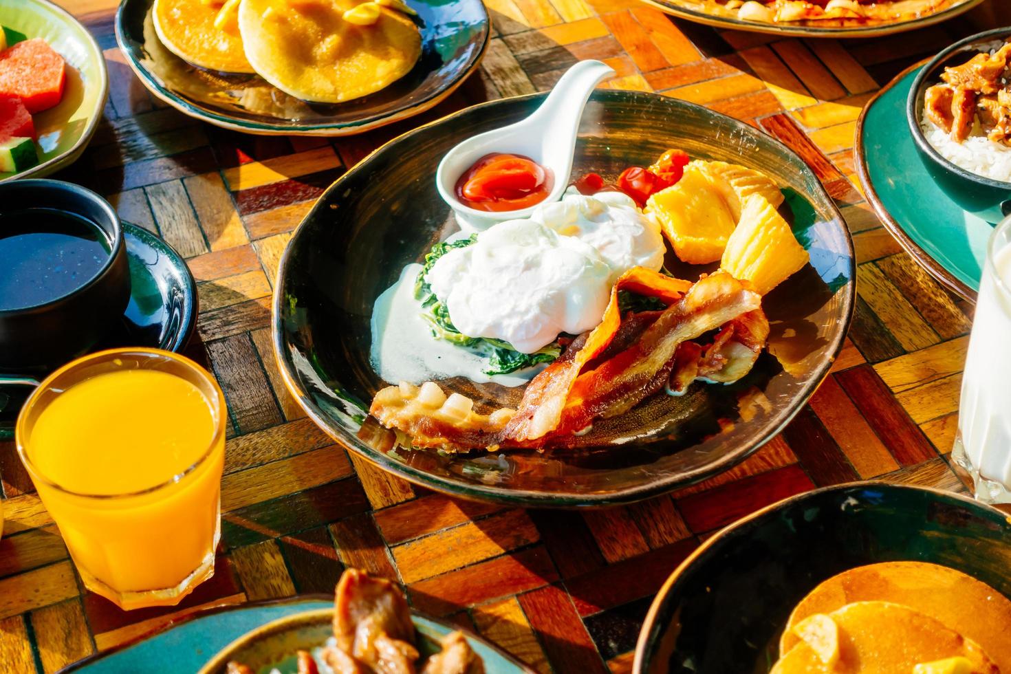 Healthy breakfast set with egg, bacon, pancakes and orange juice photo