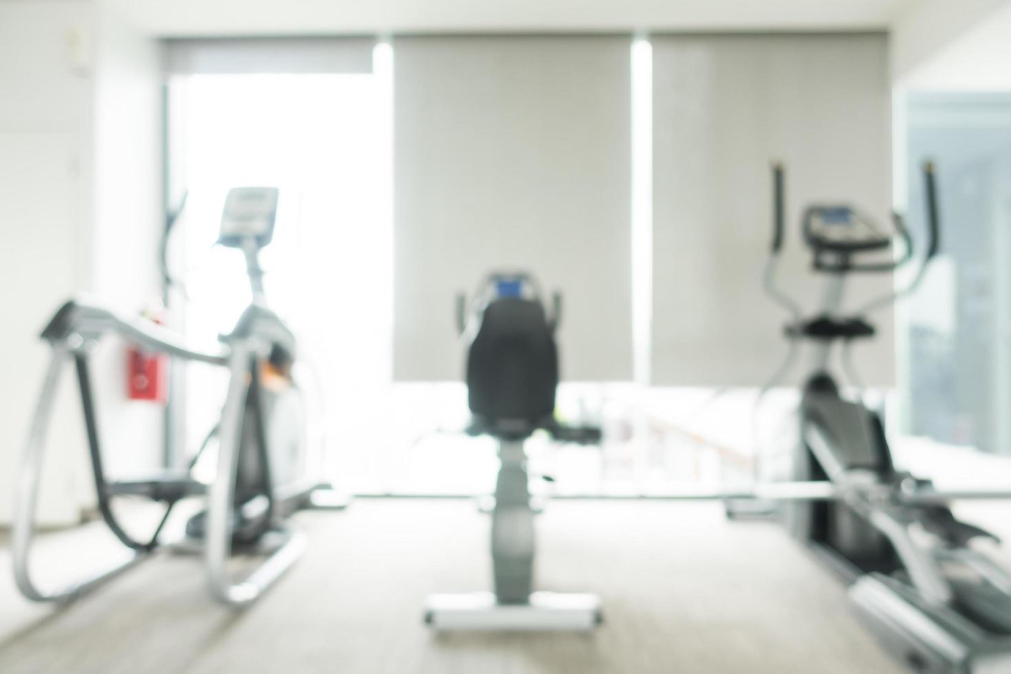 Defocused gym and fitness club interior photo